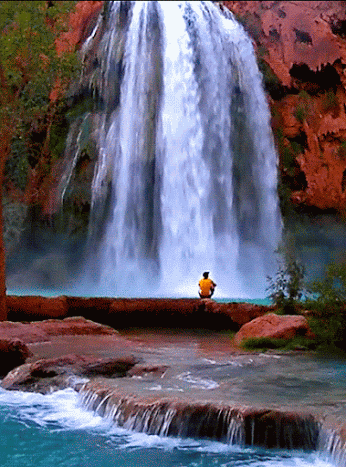 Nature gif card. Man and waterfall. Magnificent waterfall. Man look at the beauty of nature. Magnifying nature. Free Download 2024 greeting card
